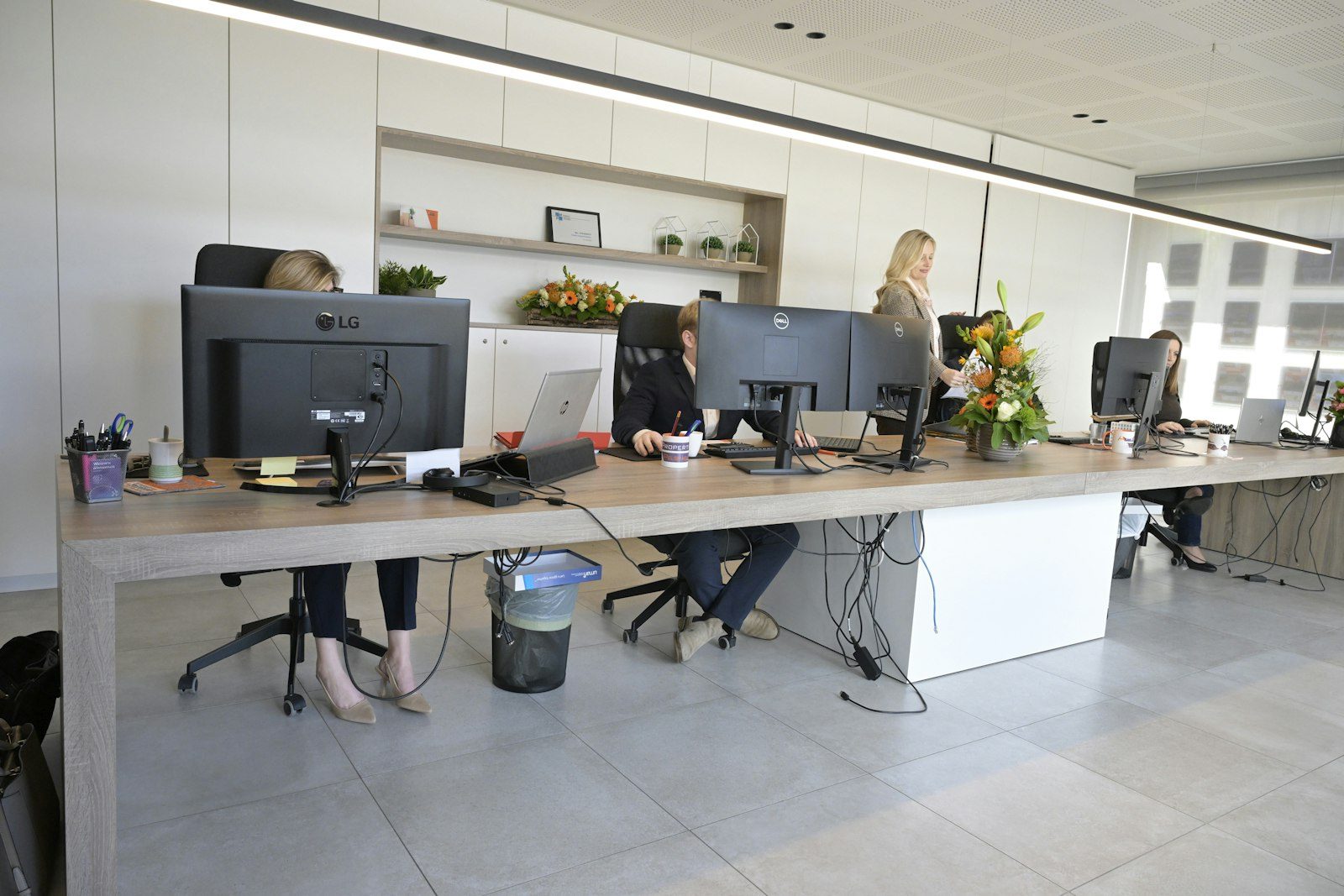Open-plan office with people working at desks